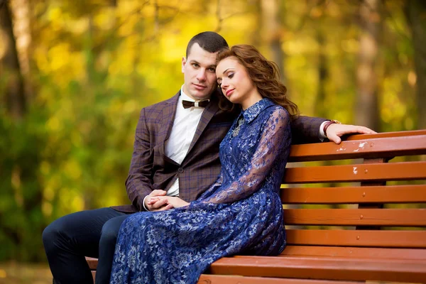 Love and celebrate concept. Young beautiful couple sitting in th — Stock Fotó
