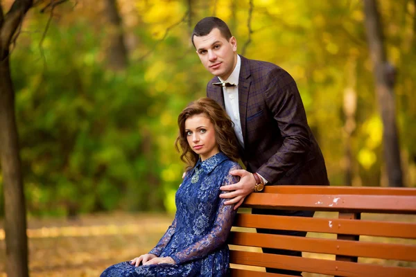 Groom and Bride in a park. wedding dress. autumn — Zdjęcie stockowe