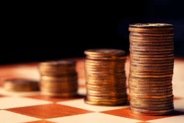 Pile of coins in pyramid form Photo of piles of coins in  form Stock Photo