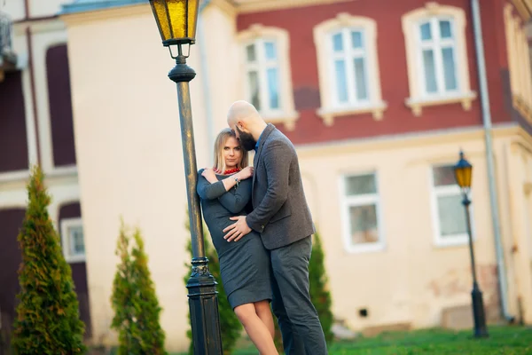 Young happy laughing and smiling couple in love posing outdoor in summer time at bright vintage clothes — Stock Photo, Image