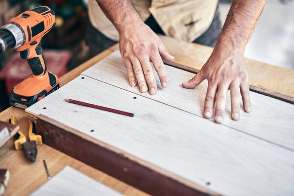 Man assembling furniture and fixing it - hobby concept.