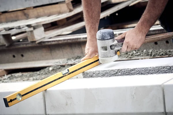 Construction worker working on a street reconstruction.