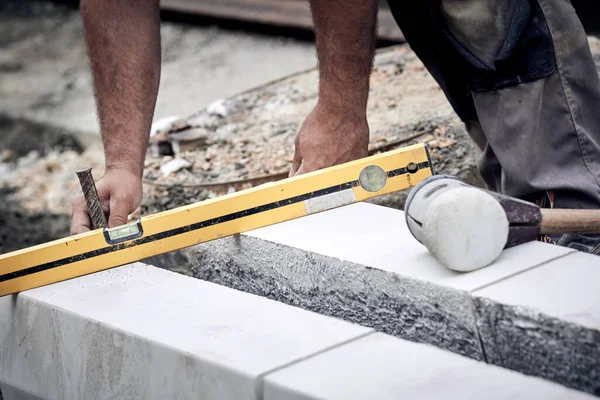 Construction worker working on a street reconstruction.