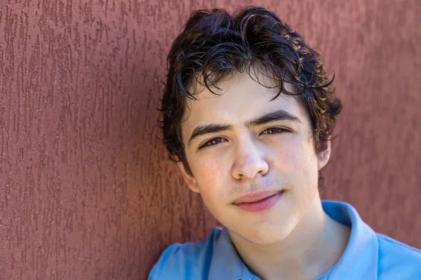 Boy Smiles Leaning Grunge Red Wall — Stock Photo, Image