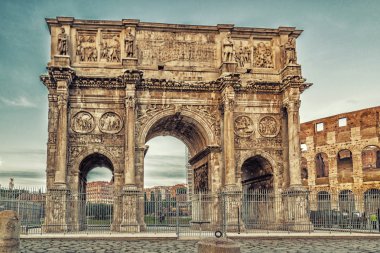 the imposing walls of a Roman triumphal arch and amphitheater clipart