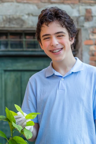 Teenager Braces Smiles While Taking Care Lemon Tree Holding Green — Stock Photo, Image