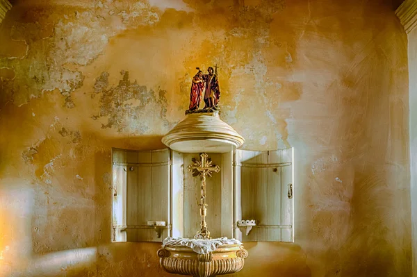 ancient baptismal font in Italy