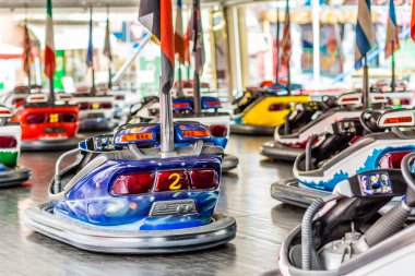 dodgems, small electric cars in a small town fair clipart