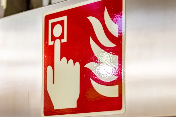 fire alarm red signal on steel panel