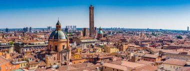 Aerial panoramic cityscape of Bologna, Italy,  above rooftops of  typical houses, ancient buildings and medieval towers clipart