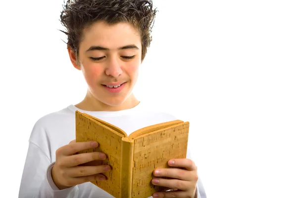 Cute boy reads brown cork blank book smiling — Stock Photo, Image