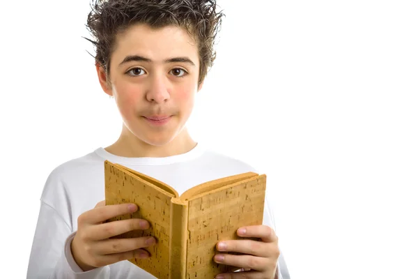 Cute boy reads brown cork blank book smiling — Stock Photo, Image