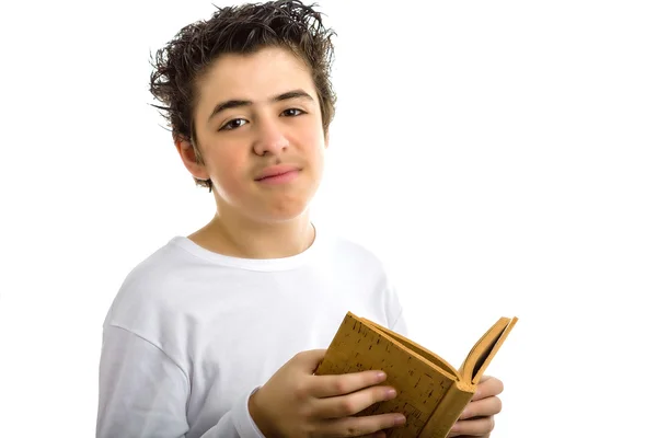Enttäuschter süßer Junge liest braunes Korkbuch — Stockfoto
