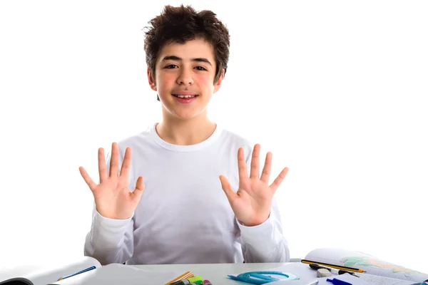Tiener jongen op huiswerk notitieboek glimlachend en weergegeven: nummer 1 — Stockfoto