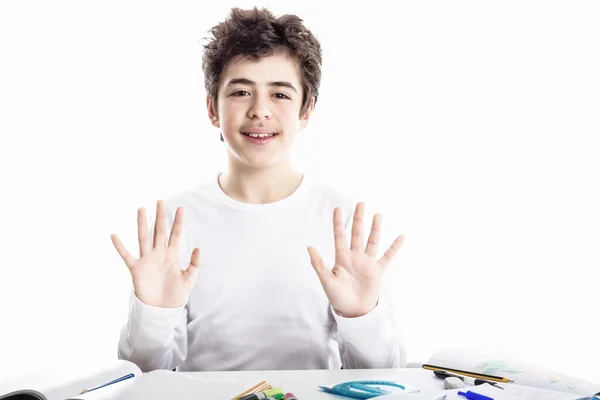 Teenager boy on homework blank book smiling and showing number 1 — Stock Photo, Image