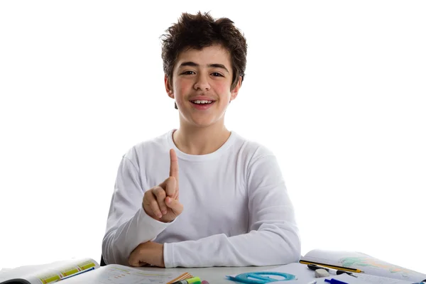 Teenager boy on homeworks smiling and showing number 1 — Stock Photo, Image