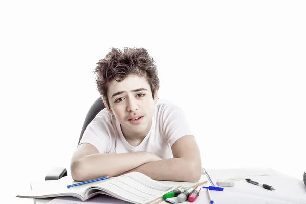 Tired boy doing homework — Stock Photo, Image