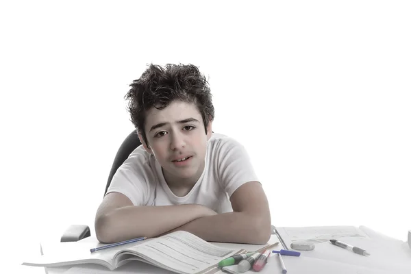 Tired boy doing homework — Stock Photo, Image