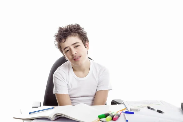 Tired boy doing homework — Stock Photo, Image