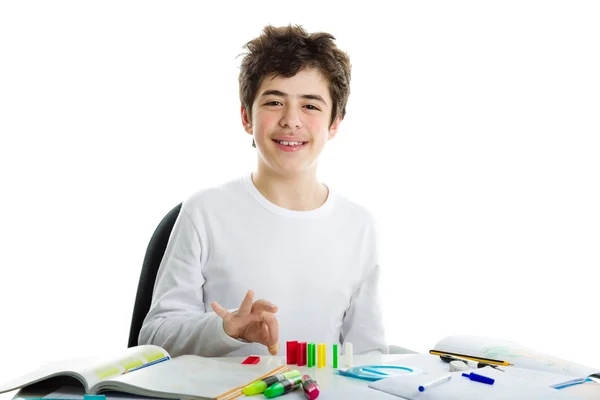 Boy playing with dominoes on homework — Stock Photo, Image