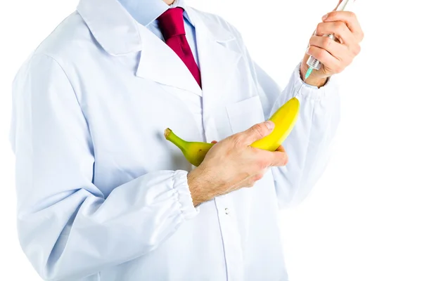 Orvos injekciót a banán így fehér kabát — Stock Fotó