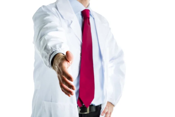 Doutor em casaco branco oferecendo aperto de mão — Fotografia de Stock