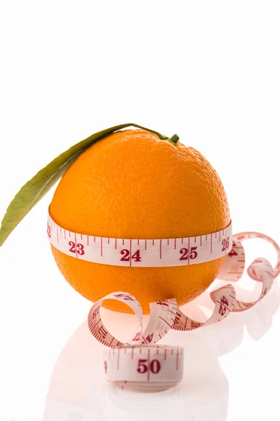 Orange fruit and measuring tape — Stock Photo, Image