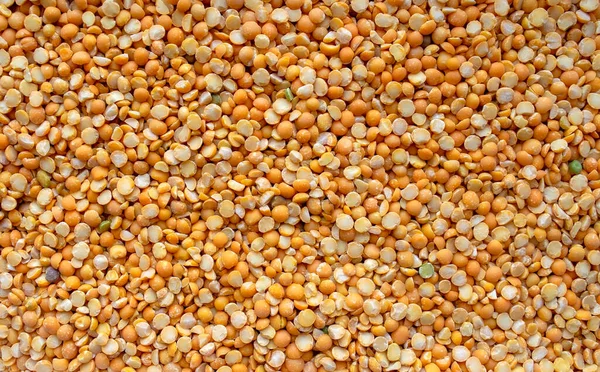 Dry Split Sarı Bezelye Arkaplanı. Sarı kuru bezelye arkaplanı. Üst Manzara. Yemek arkaplanı. Bezelye taneleri dokusu