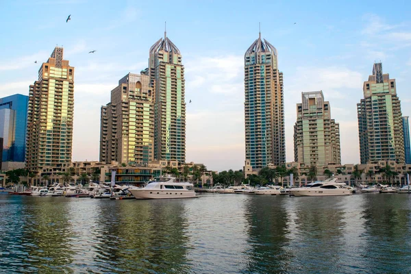 Dubai - UAE - November 11, 2020: Dubai Marina luxury tourist district with skyscrapers and parked yachts in canal. End of Dubai Marina — Stock Photo, Image