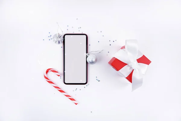 Smartphone Cadeau Canne Sur Fond Blanc Concept Noël Image En Vente