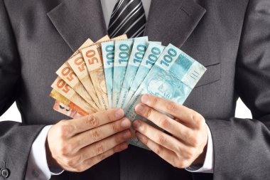 İşadamı gösteren Brezilya para
