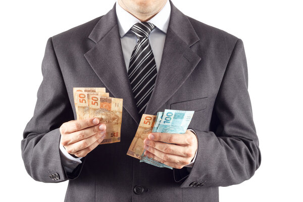 Бизнесмен считает бразильские деньги
