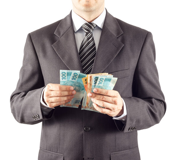 Бизнесмен считает бразильские деньги
