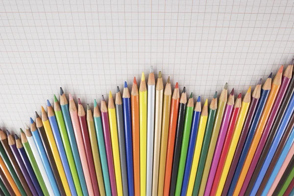 Colored pencils lined up — Stock Photo, Image