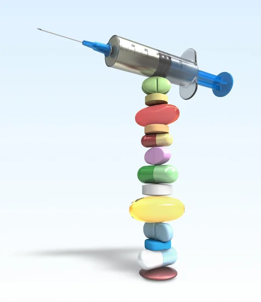 Equilibrium of pills and syringe — Stock Photo, Image