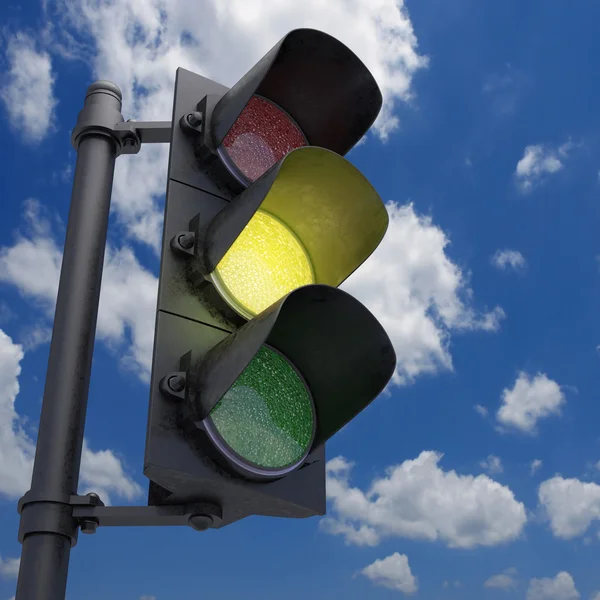 Traffic Light in a blue sky with only the yellow light on. — Stock Photo, Image