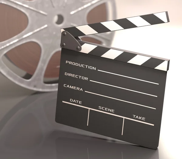 Clapboard with a roll of film — Stock Photo, Image