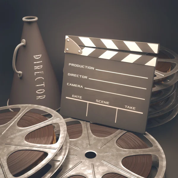 Clapperboard with rolls of film — Stock Photo, Image