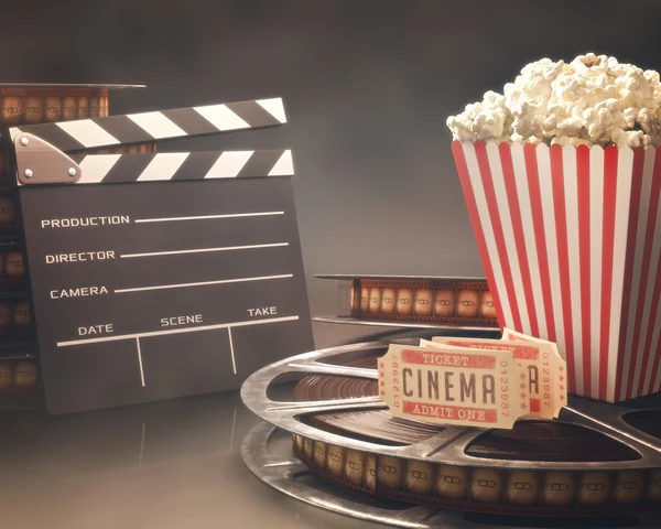 Objects related to the cinema on reflective surface. — Stock Photo, Image