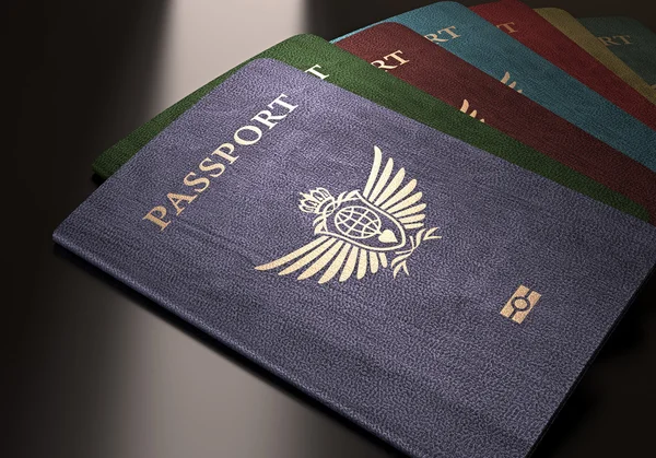 Барвисті паспорти на столі — стокове фото