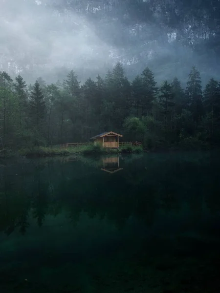 Low clouds fog misty mood reflection forest wood cabin in clear calm alpine mountain Lake Bluntausee Salzburg Austria — Stock Photo, Image
