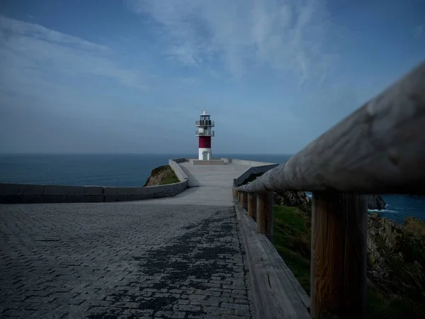 Panorama of Cabo Ortegal lighthouse on steep rocky cliff atlantic ocean bay of biscay Carino Cape Galicia Spain — Stock Photo, Image