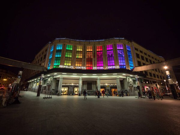 Rainbow color lights illumination of modernist Brussels Central train station Bruxelles Centraal main entrance Belgium
