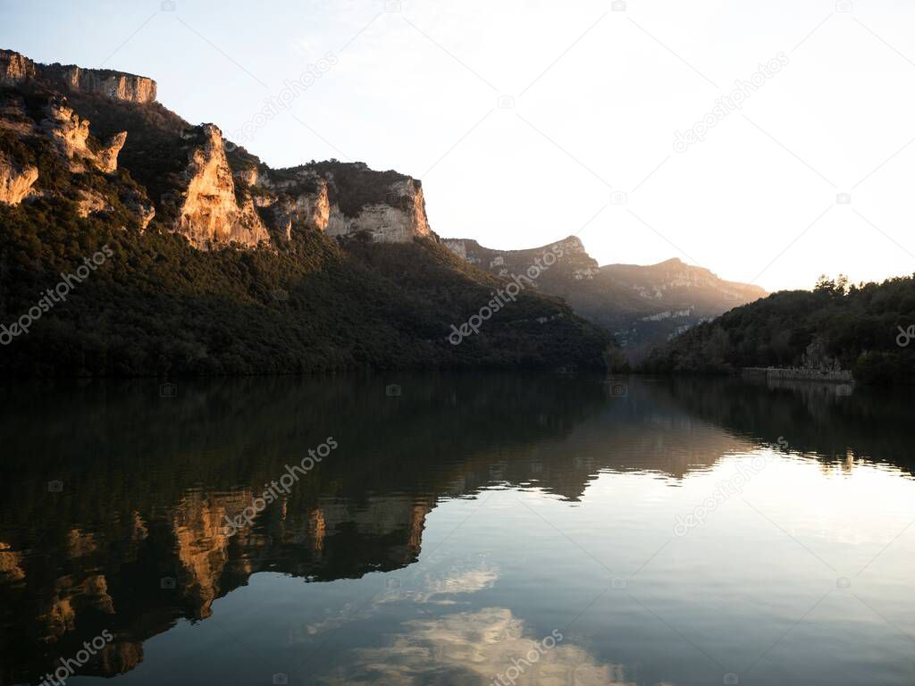 Reflection of mountains in Ebro river lake dam Embalse de Sobron on border of Basque Country Castile and Leon Spain Europe