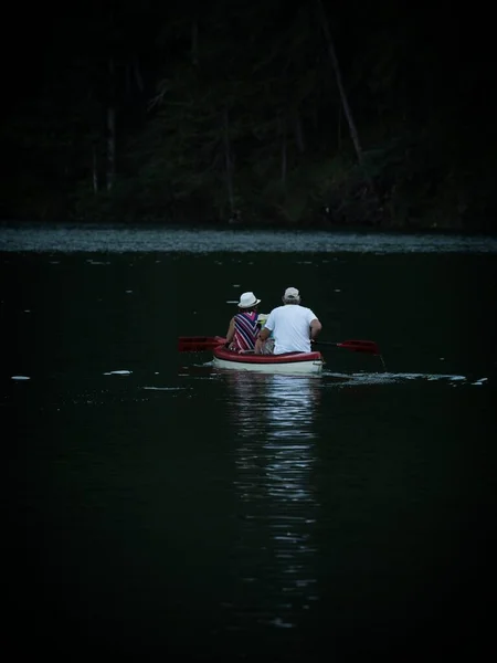 Elderly Senior Couple Wooden Rowing Paddle Boat Calm Alpine Mountain — Stock Photo, Image