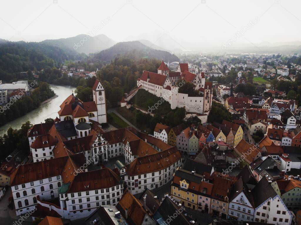 Aerial panorama of historic old town centre of Fuessen Fussen Hohes Schloss Benedictine monastery St Mang at lech river in Ostallgaeu Allgau, Swabia Bavaria Germany Europe