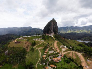 Aerial panorama of Piedra Del Penol El Penon de Guatape rock stone inselberg monolith granite dome in Antioquia Colombia clipart