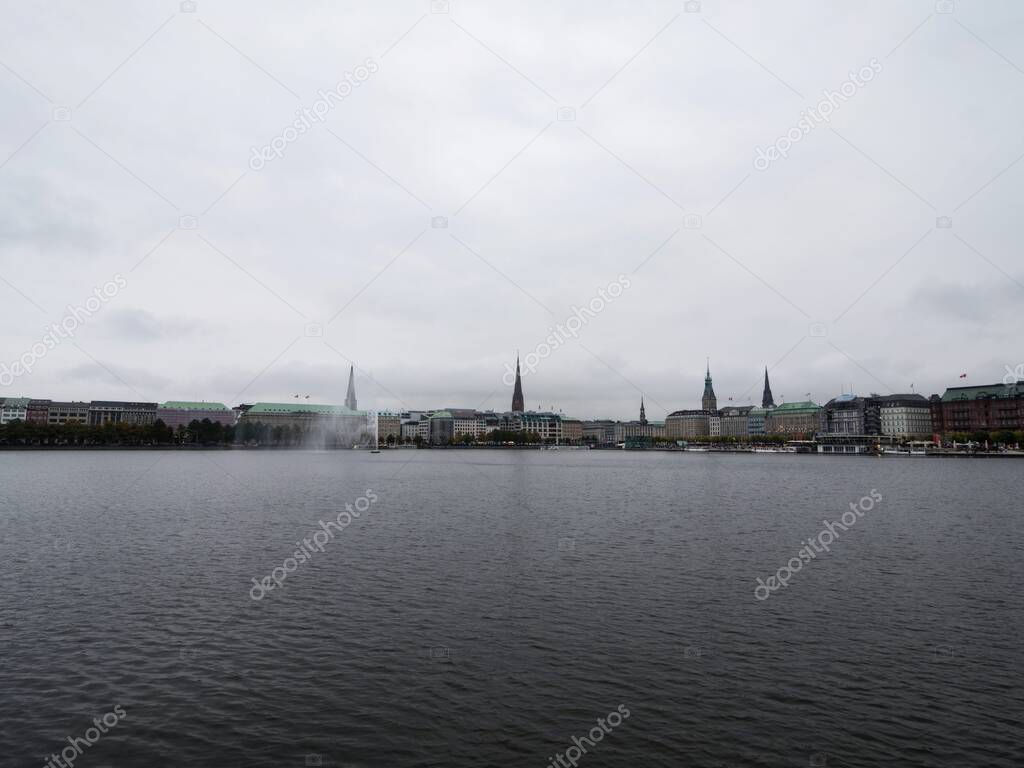 Panoramic cityscape skyline view of Hamburg downtown city centre from artificial lake Binnenalster at Elbe river Germany