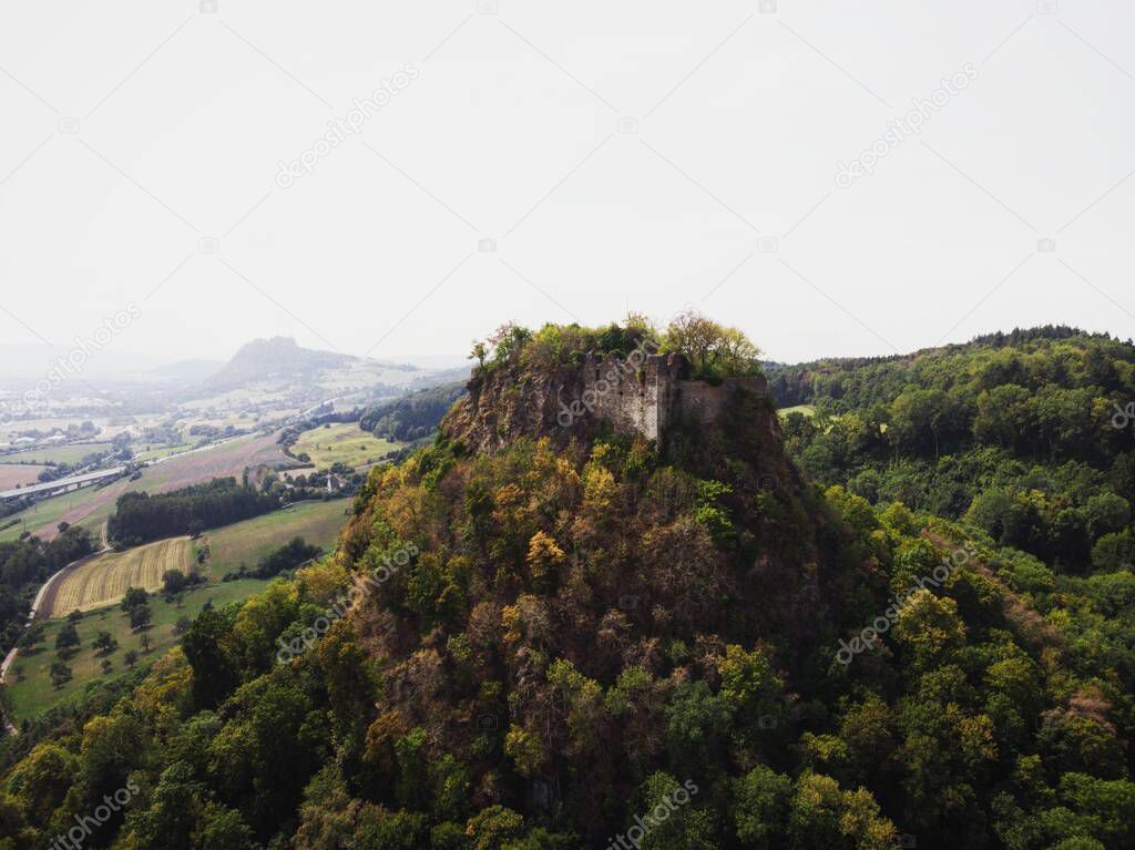 Aerial panorama of Hegau volcano mountain Hohenkraehen medieval hill castle ruins Singen Konstanz Germany