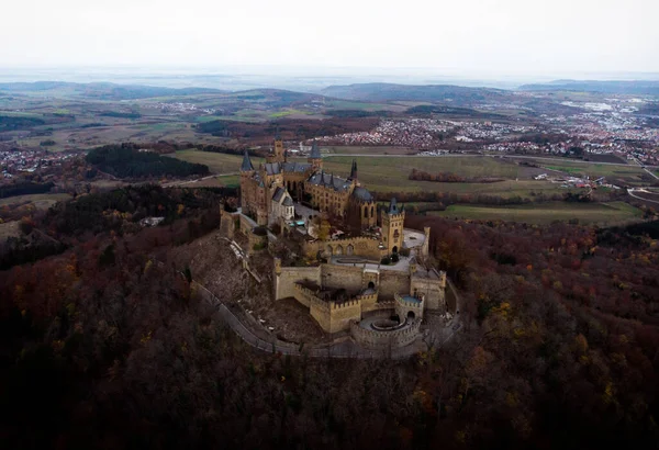 Aerial panorama of medieval gothic mountain hilltop castle Burg Hohenzollern Hechingen Swabian Jura alps autumn Germany